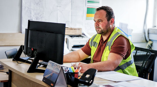 Photograph of trucking management in an office