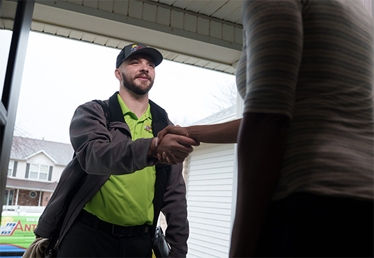Professional man shaking a female customer's hand