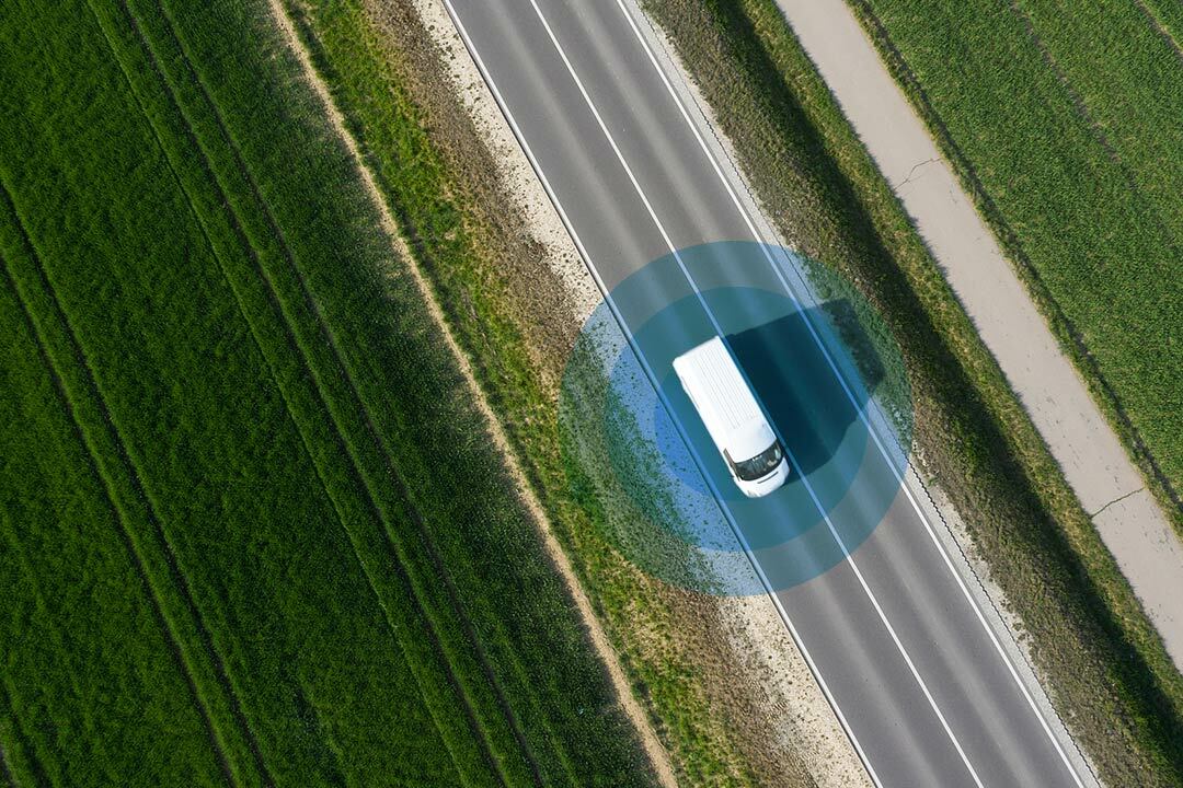 Sky view of fleet vehicle driving on a road