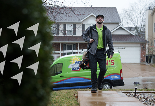 service person with wrapped van walking up to front door