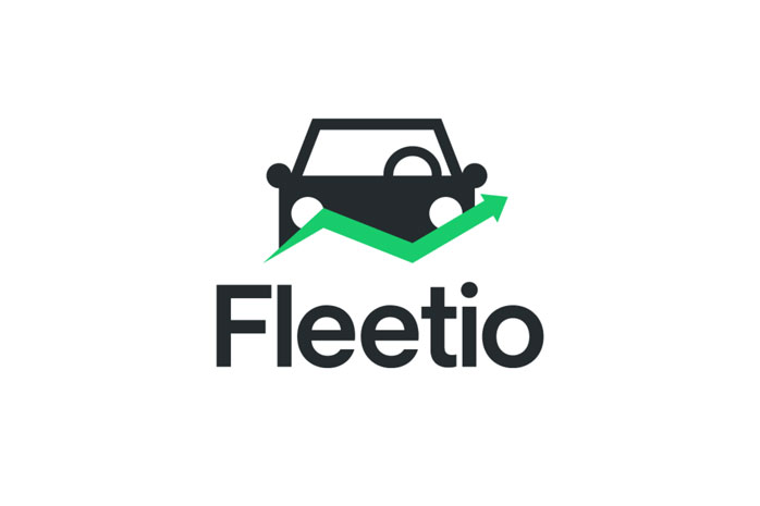 The Fleetio logo features a dark gray stylized car icon with a green arrow pointing upward and to the right, positioned above the word "Fleetio" in dark gray text.