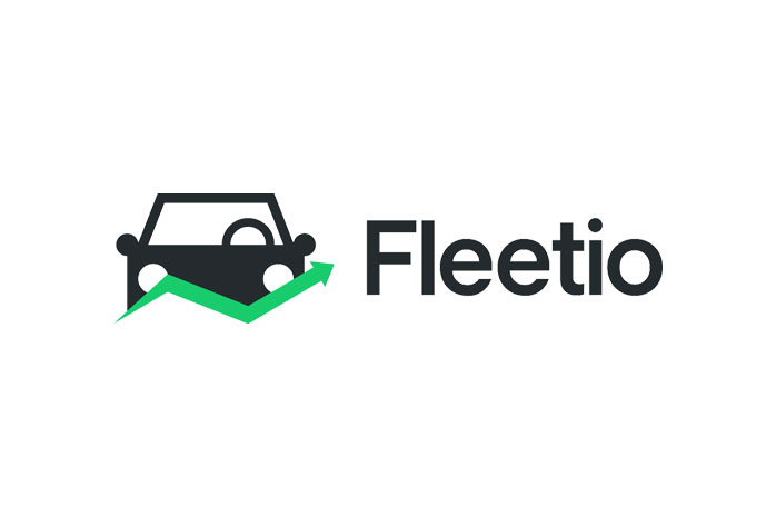 Fleetio logo featuring a clean, minimal car icon with a green upward arrow, positioned alongside the word “Fleetio” in a modern dark gray typeface.