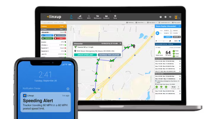 A laptop and a smartphone displaying the Linxup fleet tracking dashboard, which shows vehicle locations on a map and a recent speeding alert notification.