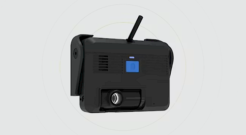 A black, compact device with a blue button and a protruding antenna, shown from a slightly angled view on a light background. The device features ventilation grilles and a camera lens on the front.
