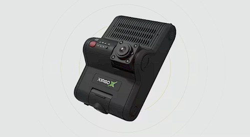 A black electronic device with a rectangular body, featuring a textured surface, a circular control knob, multiple buttons, and a logo labeled "XIRGO X" on the front.