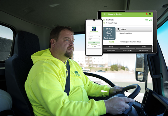 A truck driver wearing a bright yellow high-visibility hoodie drives a vehicle, overlaid with images of mobile phone and tablet screens displaying fleet management software.
